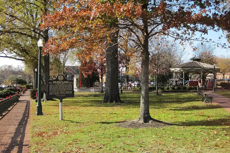 Autumn trees, a historical marker and a gazebo on the town square in Collierville, Tennessee